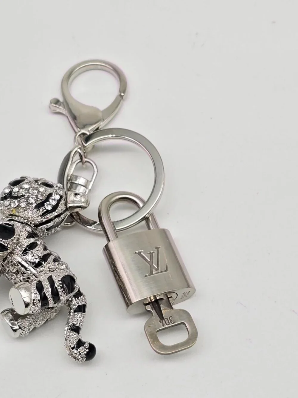 Authentic Louis Vuitton Silver Padlock with Unbranded Silver Tiger Bagcharm